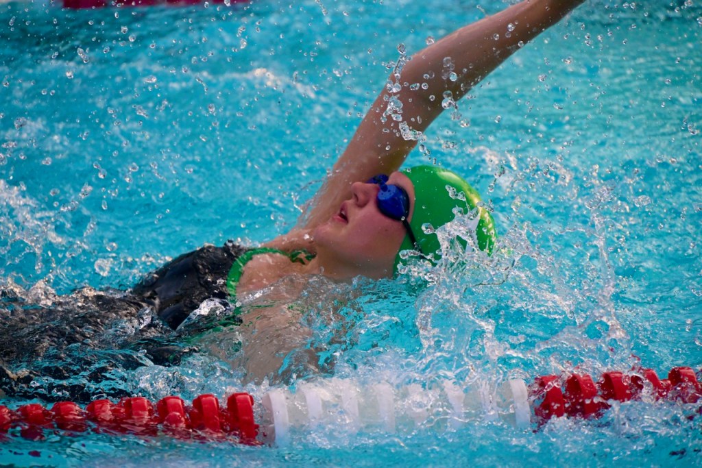 Kingstream Kahuna swimming backstroke in meet at Hunters Creek on July 1st